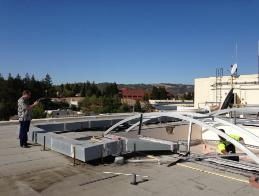 man working on roof 